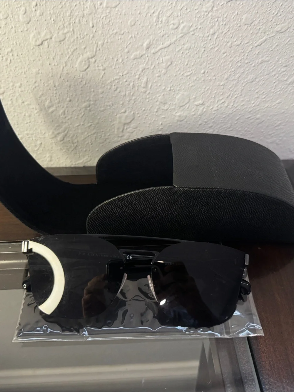 Prada Women's Black Metal Rimless Sunglasses
